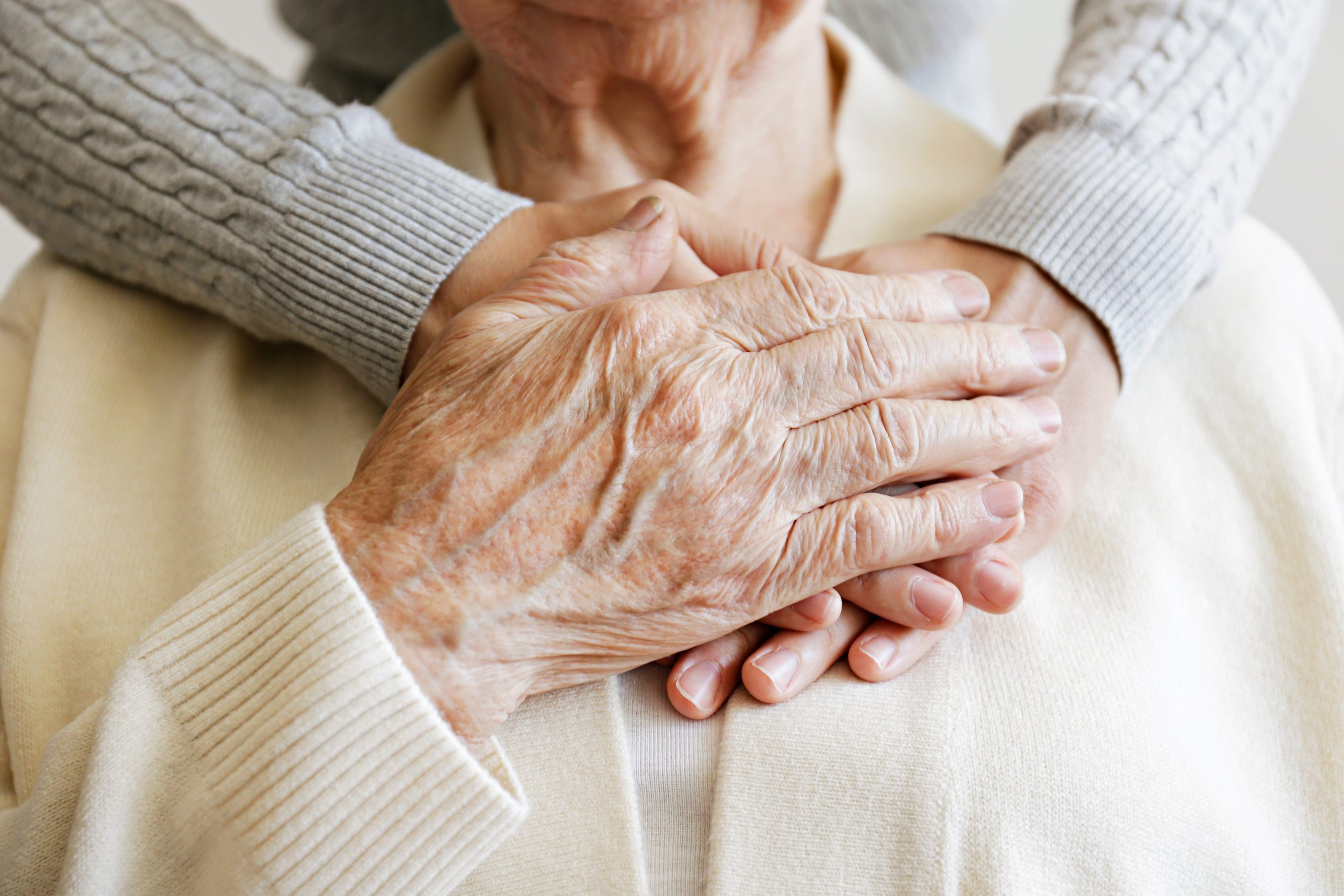 Two people holding hands